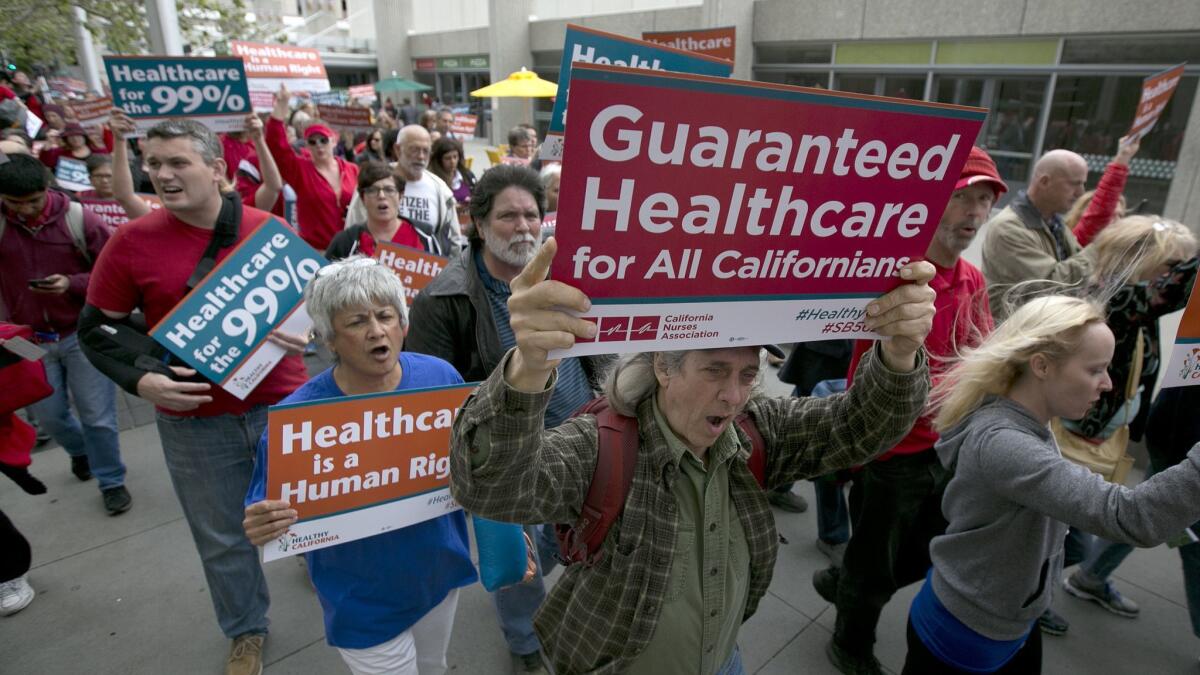 Supporters of single-payer health care march in Sacramento in April 2017. Senate Bill 562, which aims to remake the healthcare system by eliminating insurance companies and guaranteeing coverage for everyone, stalled in the state Legislature.