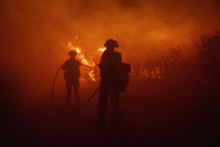 Firefighters work against the advancing Post Fire early Sunday, June 16, 2024, in Gorman, Calif. (AP Photo/Eric Thayer)