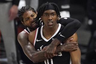 Los Angeles Clippers guard Terance Mann, right, celebrates with guard Paul George after scoring and drawing a foul during the first half in Game 6 of a second-round NBA basketball playoff series against the Utah Jazz Friday, June 18, 2021, in Los Angeles. (AP Photo/Mark J. Terrill)