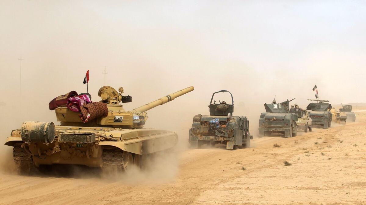 Iraqi forces deploy in the area of Shurah, south of Mosul. (Ahmad al-Rubaye / AFP/Getty Images)