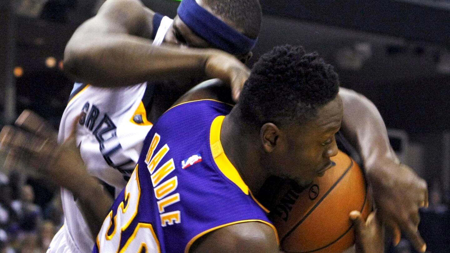 Lakers forward Julius Randle and Grizzlies forward Zach Randolph battle for a rebound during a Dec. 27 game in Memphis.