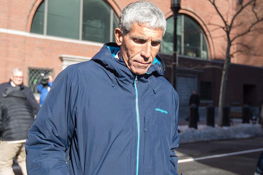 William "Rick" Singer leaves Boston Federal Court in March after being charged with racketeering conspiracy, money laundering conspiracy, conspiracy to defraud the United States, and obstruction of justice.