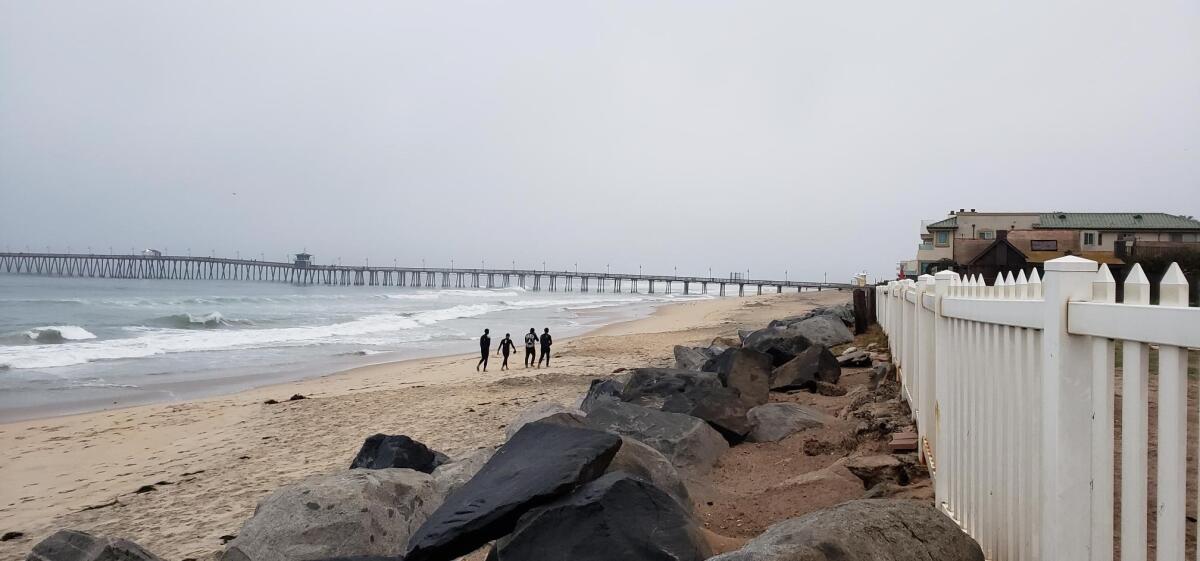 Border Patrol agents spotted three men and a teen walking north on a beach in Imperial Beach on Sunday.