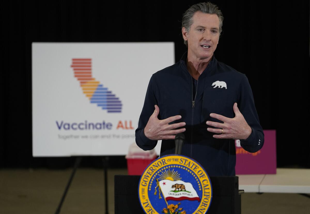 California Gov. Gavin Newsom reacts after being inoculated on April 1 in Los Angeles.