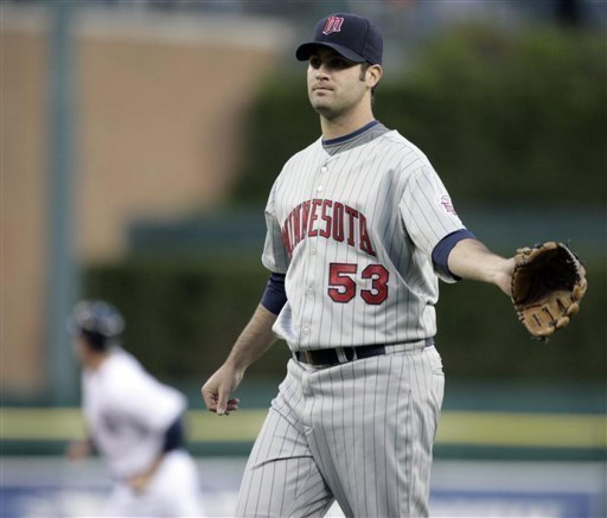 Minnesota Twins starter Nick Blackburn (53) reacts after giving up a two-run home run to Detroit Tigers' Miguel Cabrera, left, in the fourth inning of a baseball game on Tuesday, May 5, 2009 in Detroit. (AP Photo/Duane Burleson)