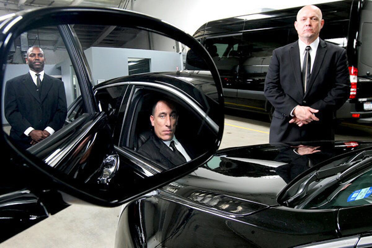 Executive chauffeurs Darrell Hollinquest, left, Christopher Smith and Reggie Colwell work for KLS Worldwide Chauffeur Services, one of the busiest limousine services during the Oscars.