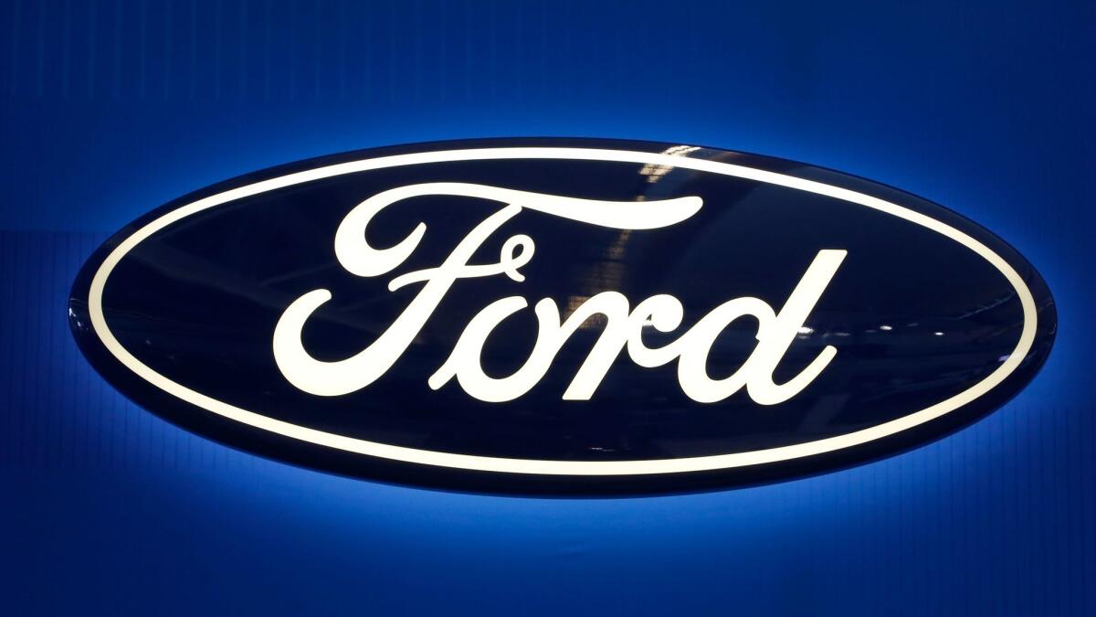 This Feb. 11, 2016, file photo shows the Ford logo on display at the Pittsburgh International Auto Show.