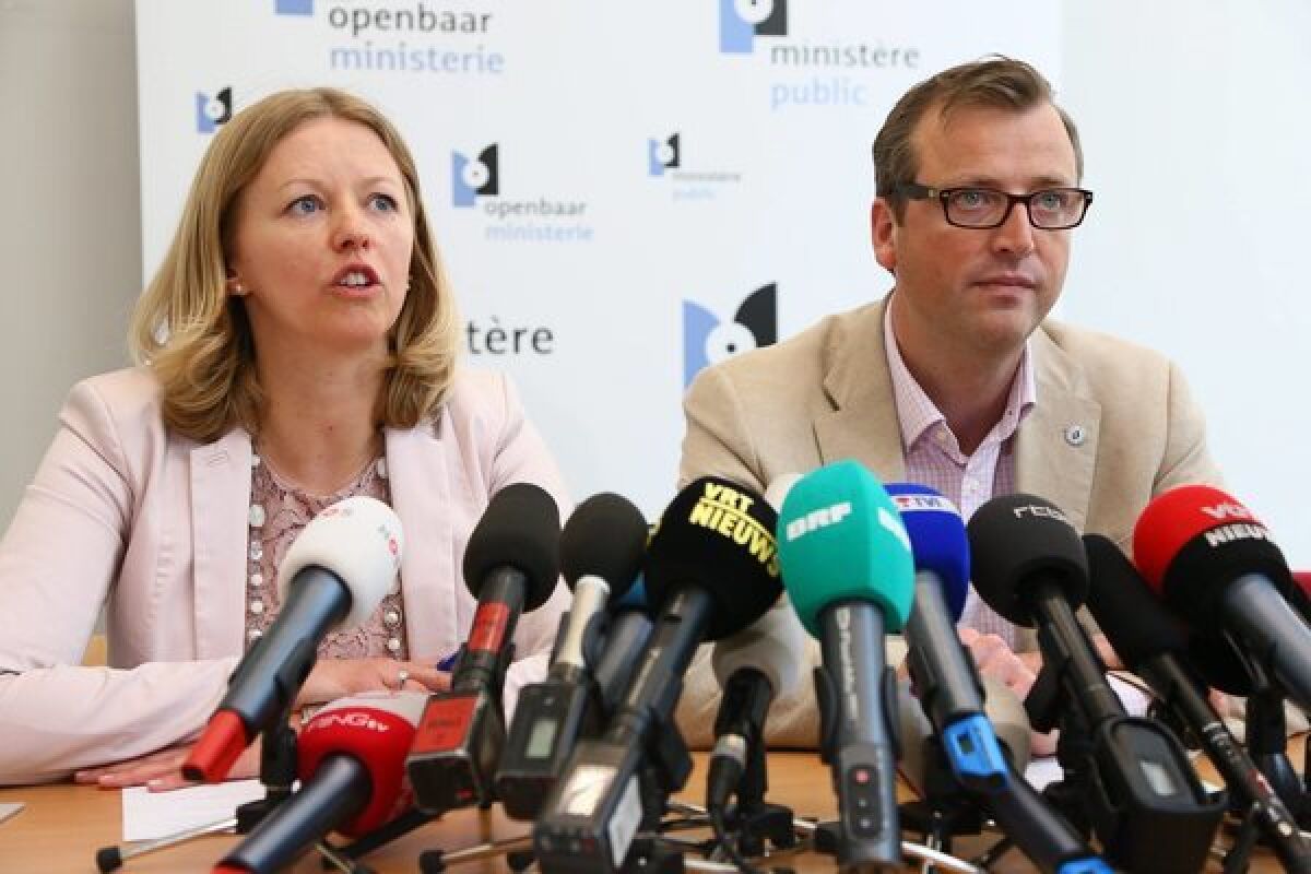 Anja Bijnens and Jean-Marc Meilleur of the Brussels prosecutor's office announce the arrest of 31 people in connection with a spectacular diamond heist at a Belgian airport.