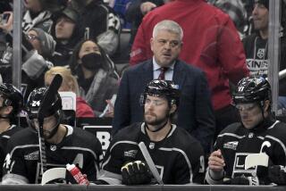 Los Angeles Kings head coach Todd McLellan looks on during the first period.