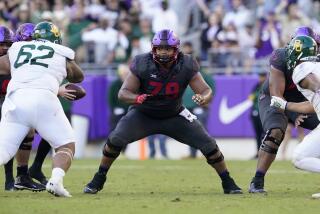 TCU center Steve Avila (79) defends against a rush by Baylor during an NCAA college football game.