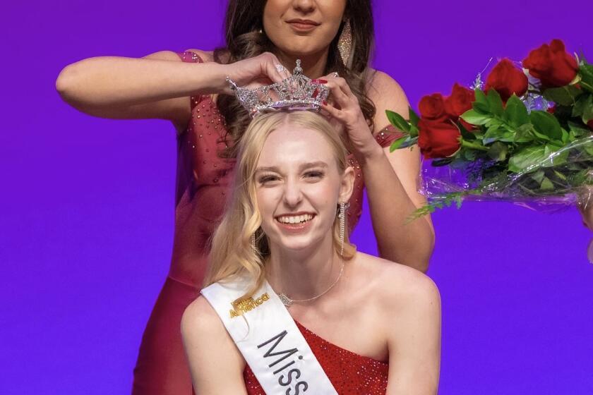 Bianca Singer, who was Miss Fountain Valley in 2022, crowns Topanga Scherf Miss Fountain Valley 2023.