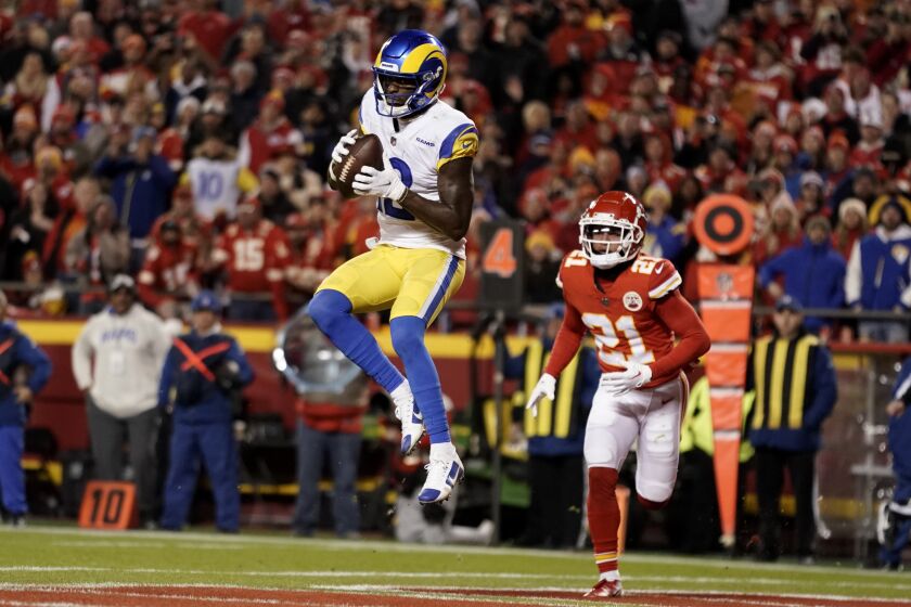 Los Angeles Rams wide receiver Van Jefferson (12) catches a 7-yard touchdown pass ahead of Kansas City Chiefs cornerback Trent McDuffie (21) during the second half of an NFL football game Sunday, Nov. 27, 2022, in Kansas City, Mo. (AP Photo/Ed Zurga)