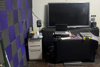 Two people set up a makeshift home at a former Marine Corps hangar Irvine, police said, decked out with disco lights, fog machine, and what appeared to be a recording studio.