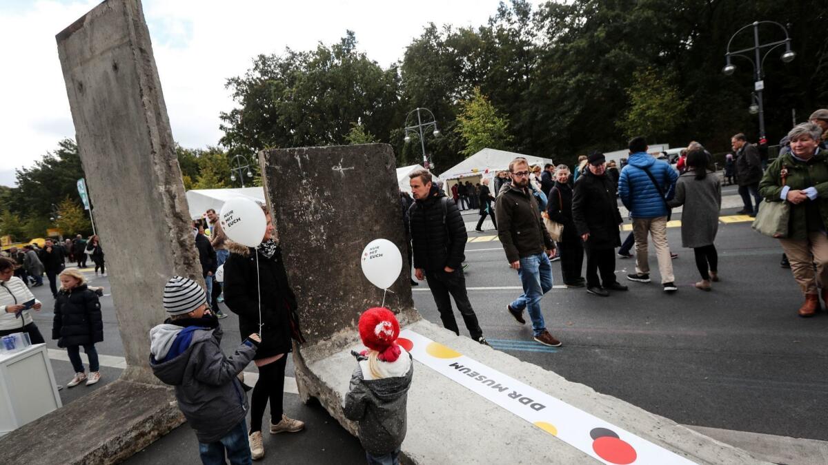 Part of the Berlin Wall displayed near Berlin's Brandenburg Gate during the German Day of Unity on Oct. 3.