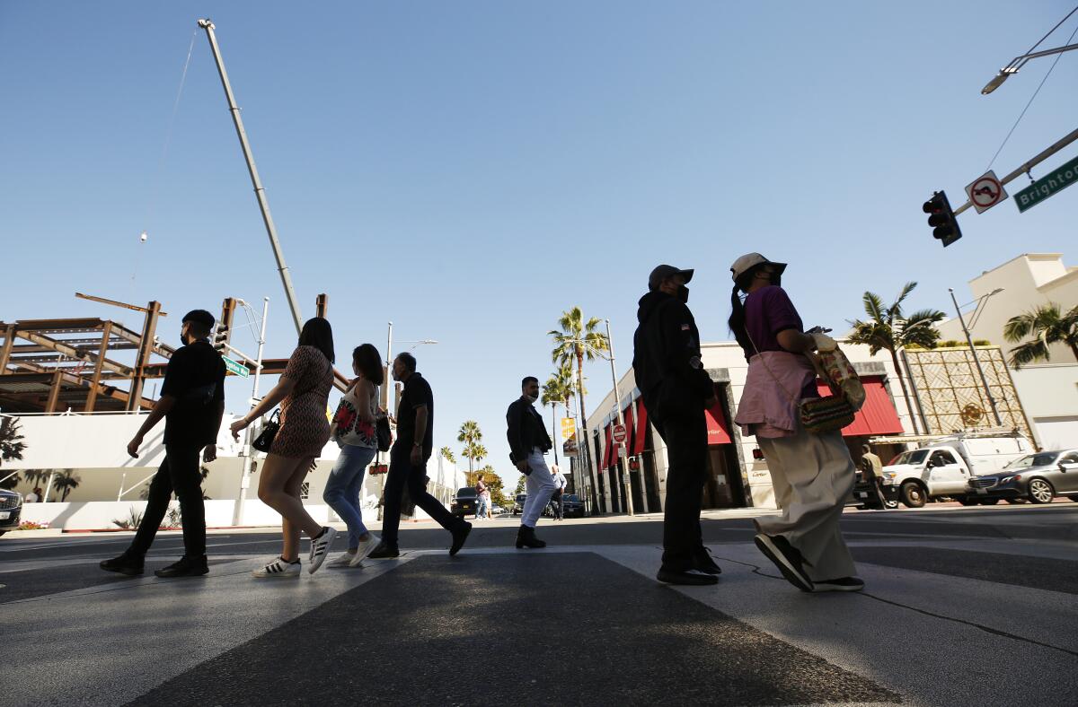 People walk along Rodeo Drive in Beverly Hills on Oct. 27. 