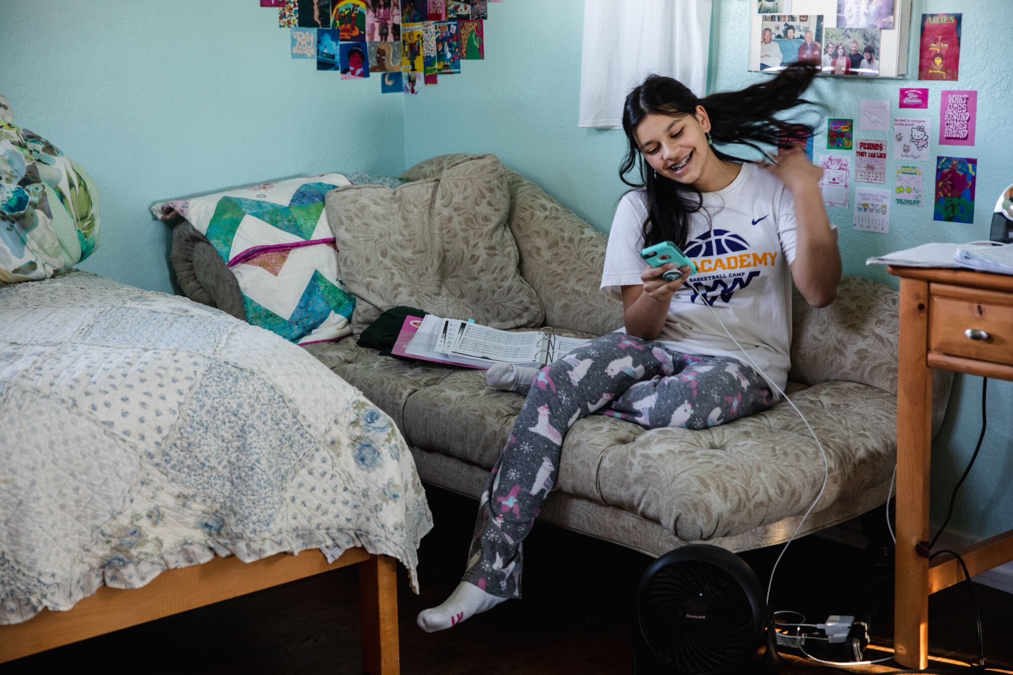 Vishaala Wilkinson talks to a friend on her phone before getting ready to go to rehearsal