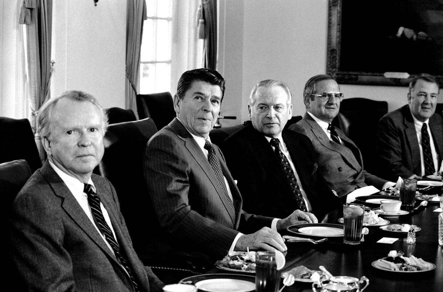 President Reagan, second from left, meets with auto industry executives including Ford President Phillip Caldwell, center, and Chrysler President Lee Iacocca during a luncheon in the White House Cabinet room in Washington on Dec. 19, 1981.