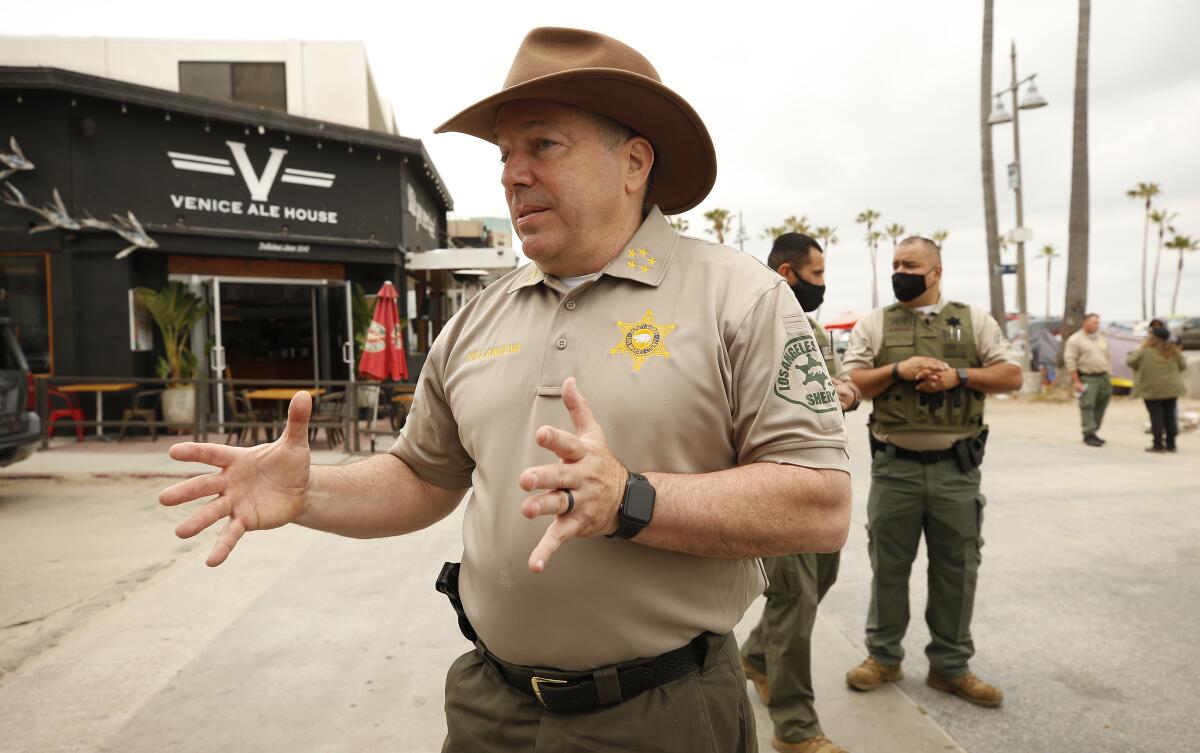 Los Angeles County Sheriff Alex Villanueva walks the Venice Boardwalk.