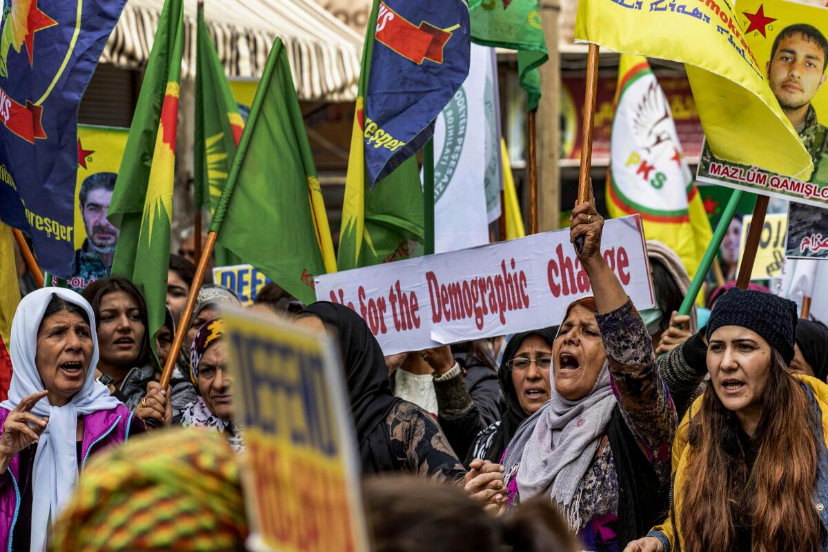 Kurds protest against Turkey in the northeastern Syrian city of Qamishli.