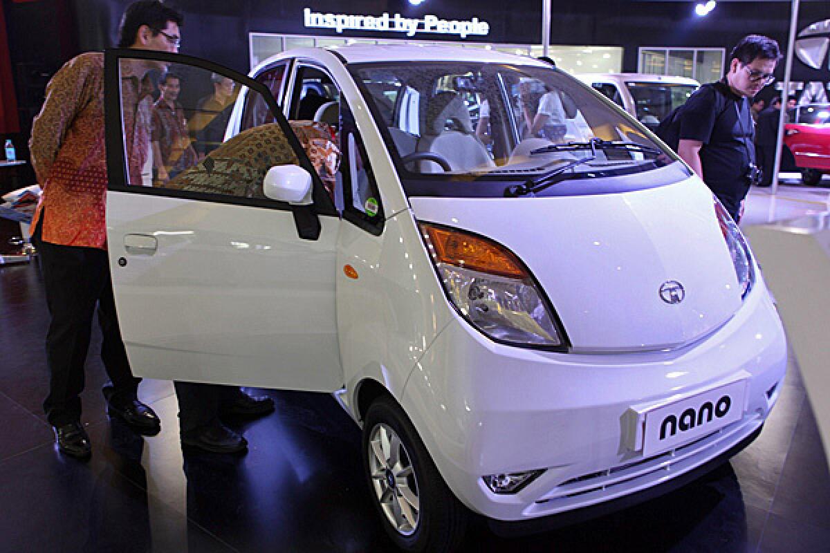 Consumers check out the Tata Nano during the Indonesia International Motor Show in September. The head of Tata Group has said the company plans to bring a version of the car to the U.S. market.