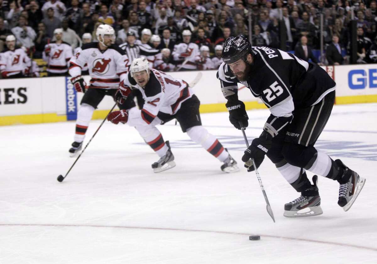 Kings winger Dustin Penner controls the puck on a breakaway opportunity during the third period of the Kings' 3-1 loss in Game 4 of the Stanley Cup Final at Staples Center.