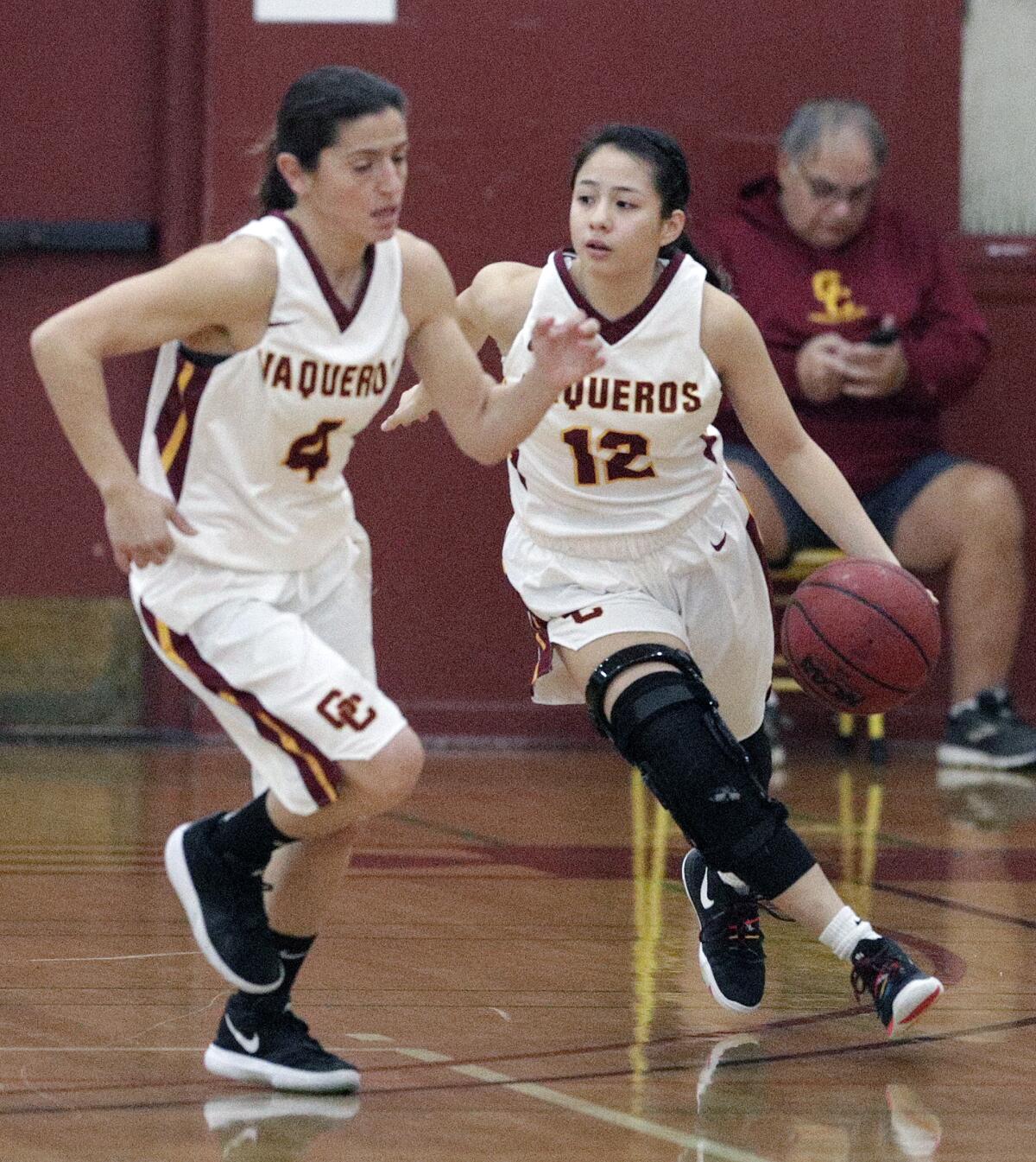 Glendale Community College's Penelopi Trieu brings the ball up court with teammate Vicky Oganyan leading early in the first quarter against Antelope Valley Community College in a Western State Conference women's basketball game at Glendale Community College on Wednesday, January 22, 2020.