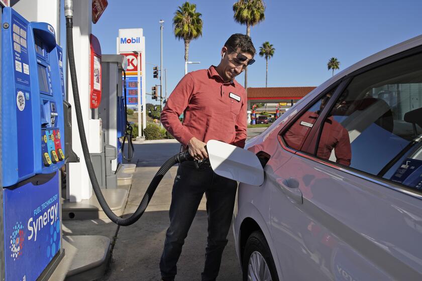 San Diego, CA - November 20: Omar Manzanares fills up at the Mobil gasoline station on Bonita Road in Chula Vista on Monday, Nov. 20, 2023 in San Diego, CA. (Alejandro Tamayo / The San Diego Union-Tribune)