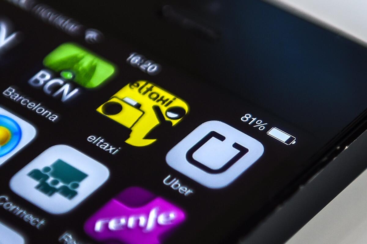 An Uber logo is seen on a smartphone in Barcelona, Spain, on July 1, 2014.