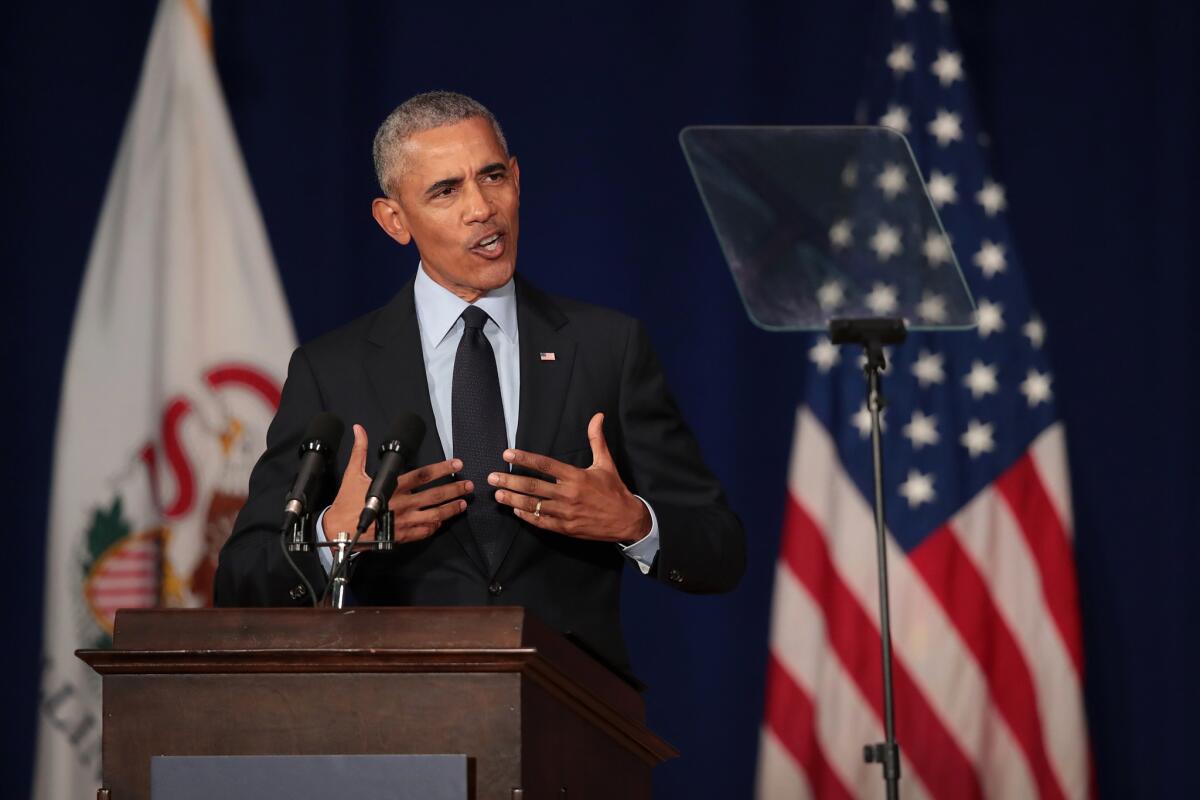 Former President Obama speaks to students Friday at the University of Illinois.