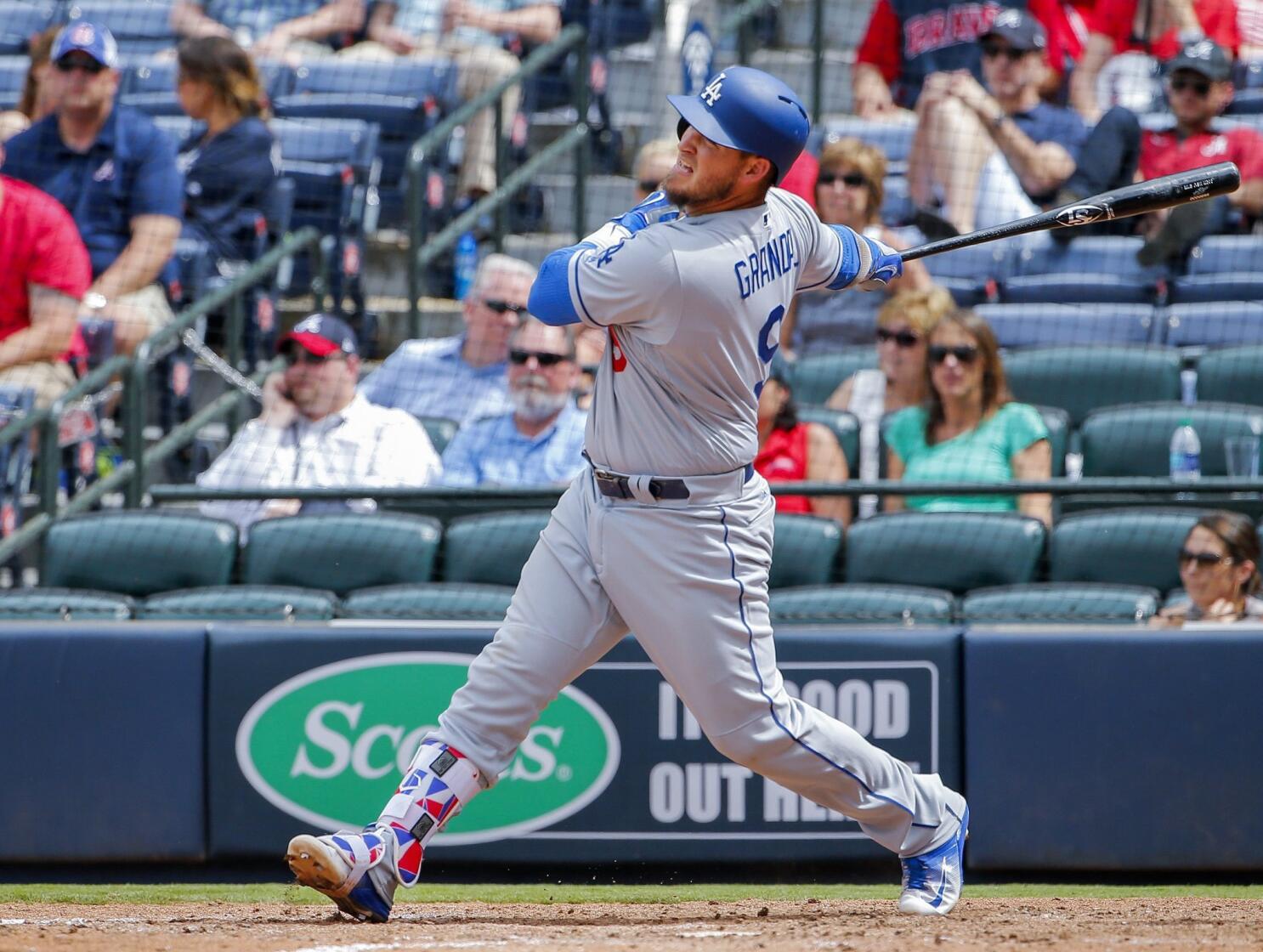 Los Angeles Dodgers' Yasmani Grandal, left, and Chase Utley, right