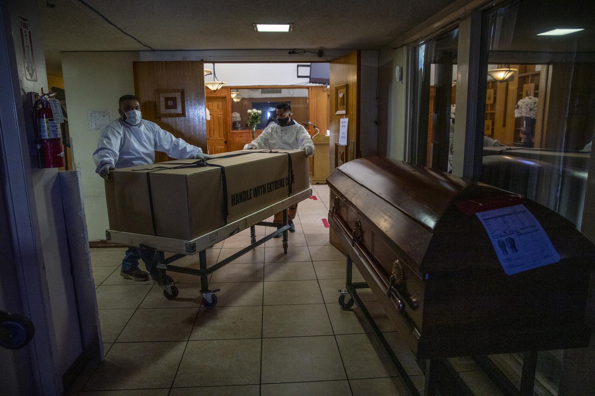 Workers inside Continental Funeral Home.