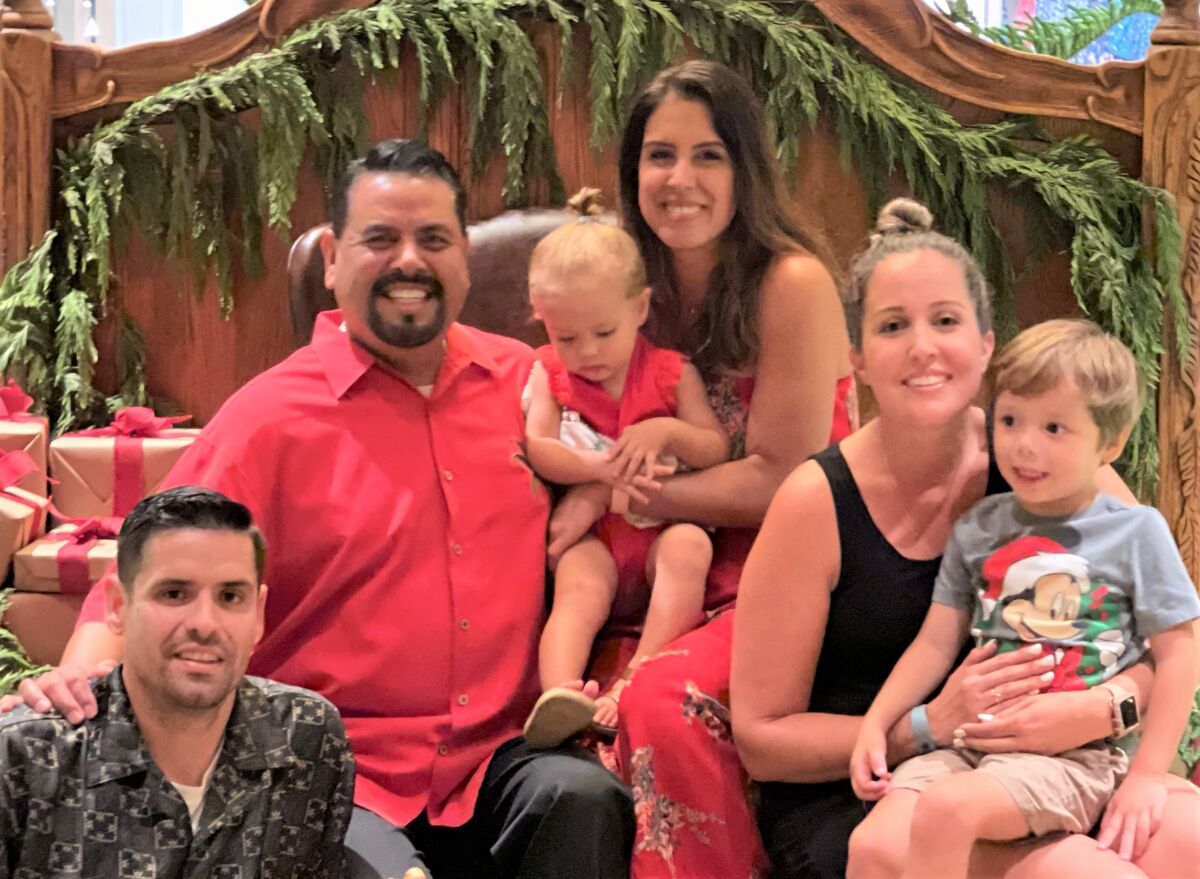 Aaron Valencia (red shirt), with his wife, adult children and grandkids who would not be here if he had made his PSA flight.