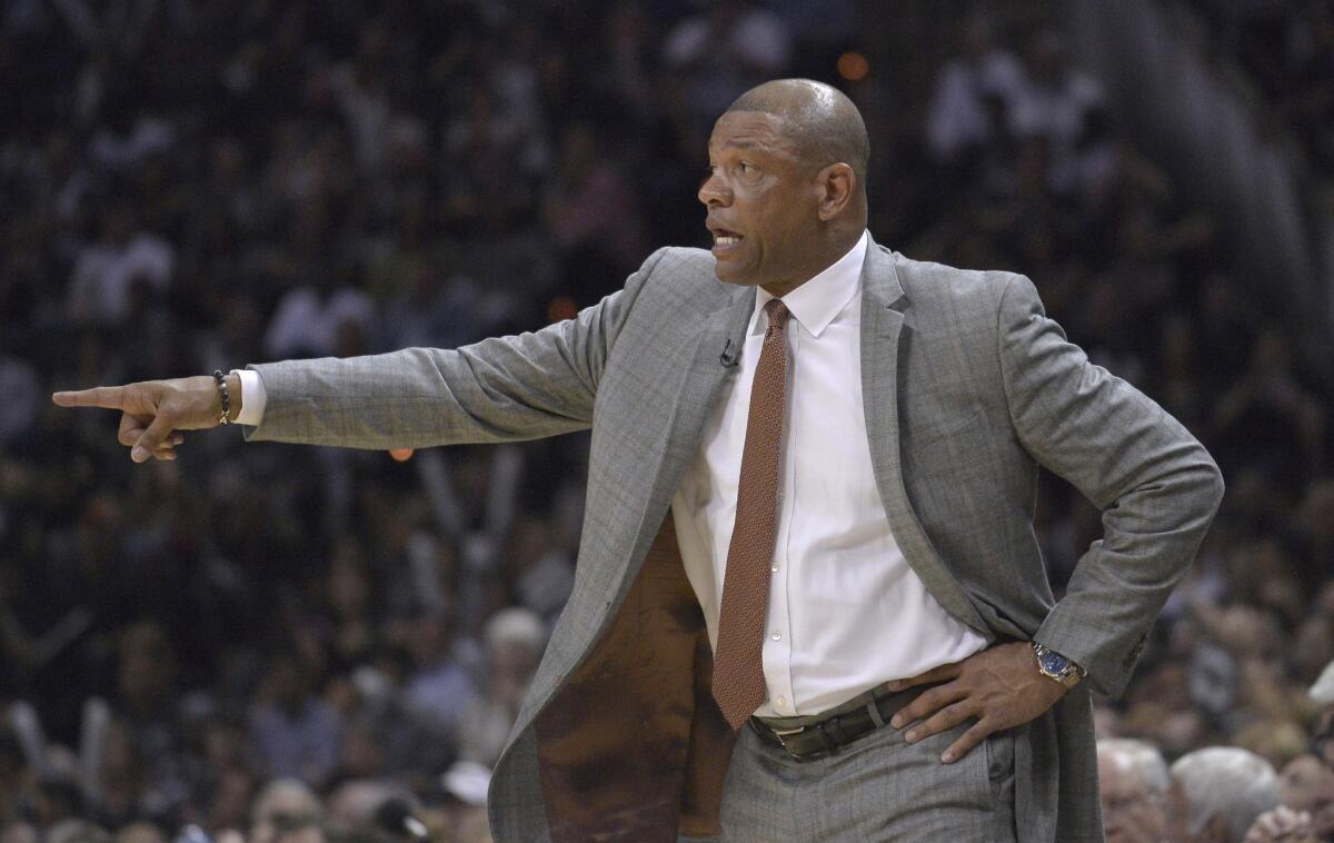 Clippers Coach Doc Rivers talks to his players as they face off against the Spurs during Game 6 of their first-round playoff series on April 30 in San Antonio.