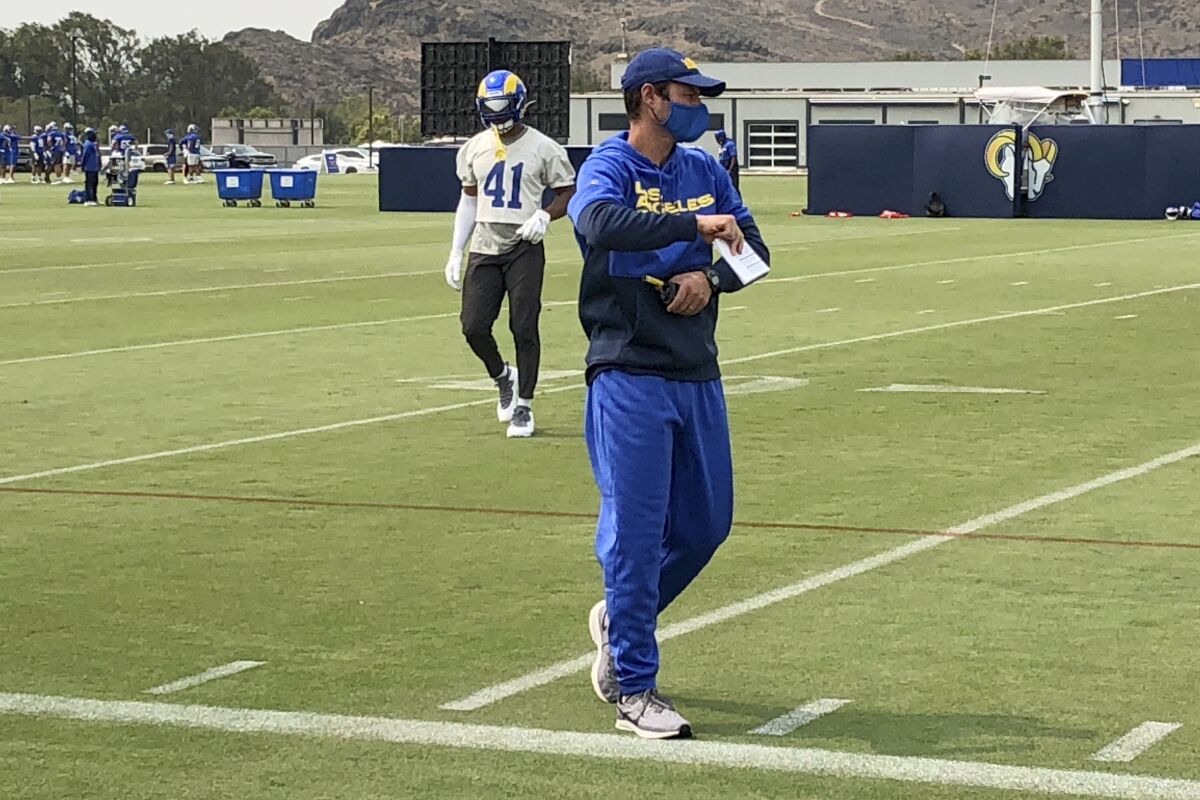 Los Angeles Rams defensive coordinator Brandon Staley watches football practice at the team's training complex in Thousand Oaks, California, on Friday, Sept. 11, 2020. Staley is in his first season as an NFL coordinator after a meteoric rise in his profession since 2016, when he was the defensive coordinator at Division III John Carroll University. (AP Photo/Greg Beacham)