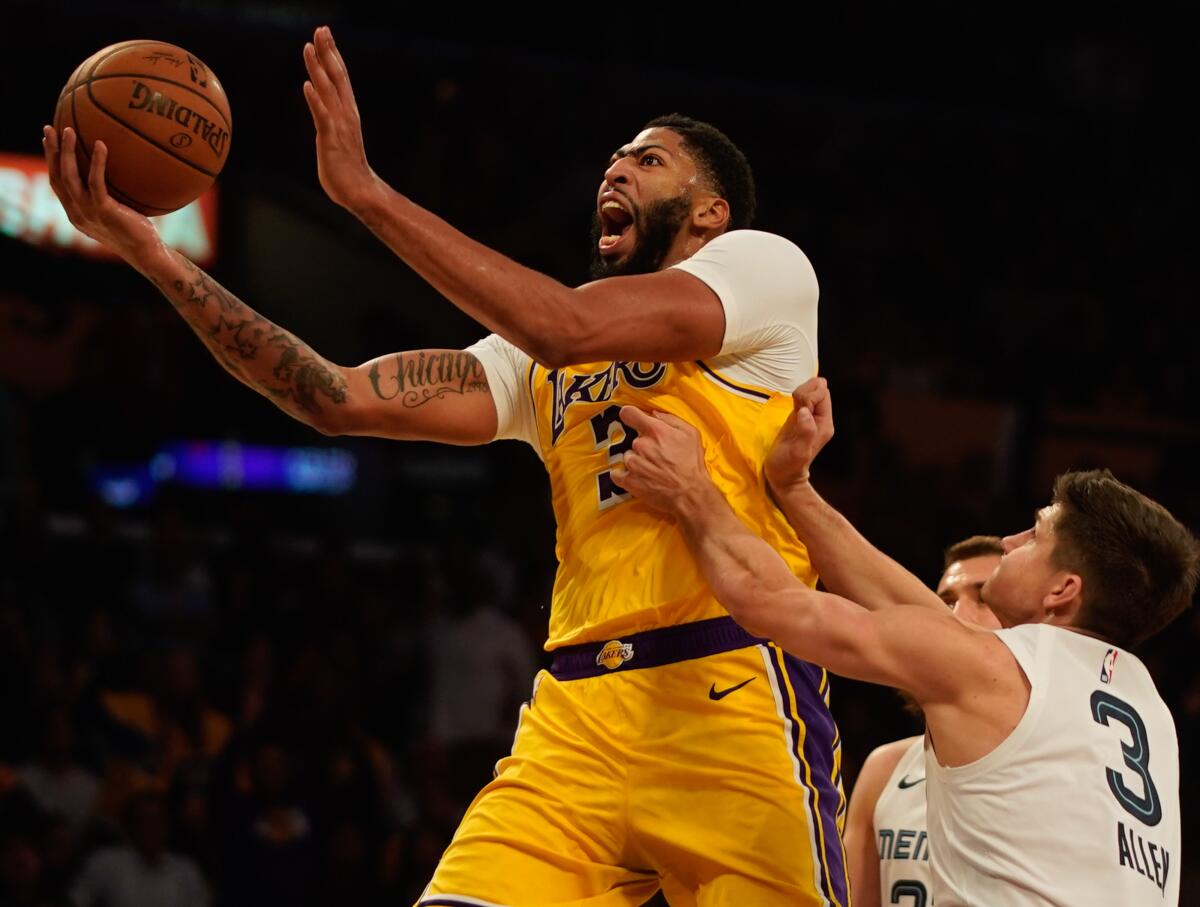 Lakers forward Anthony Davis goes for a layup against the Grizzlies on Oct. 29, 2019, at Staples Center.