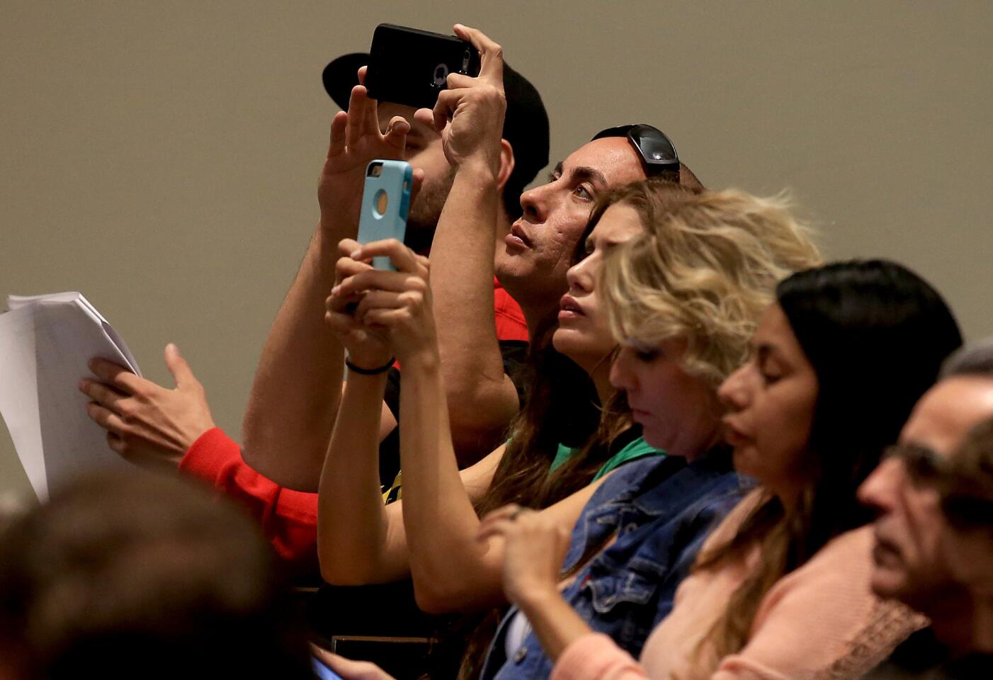 Members of the public record a lottery for licenses to operate medical marijuana dispensaries in Santa Ana during a random drawing at Santa Ana City Hall.