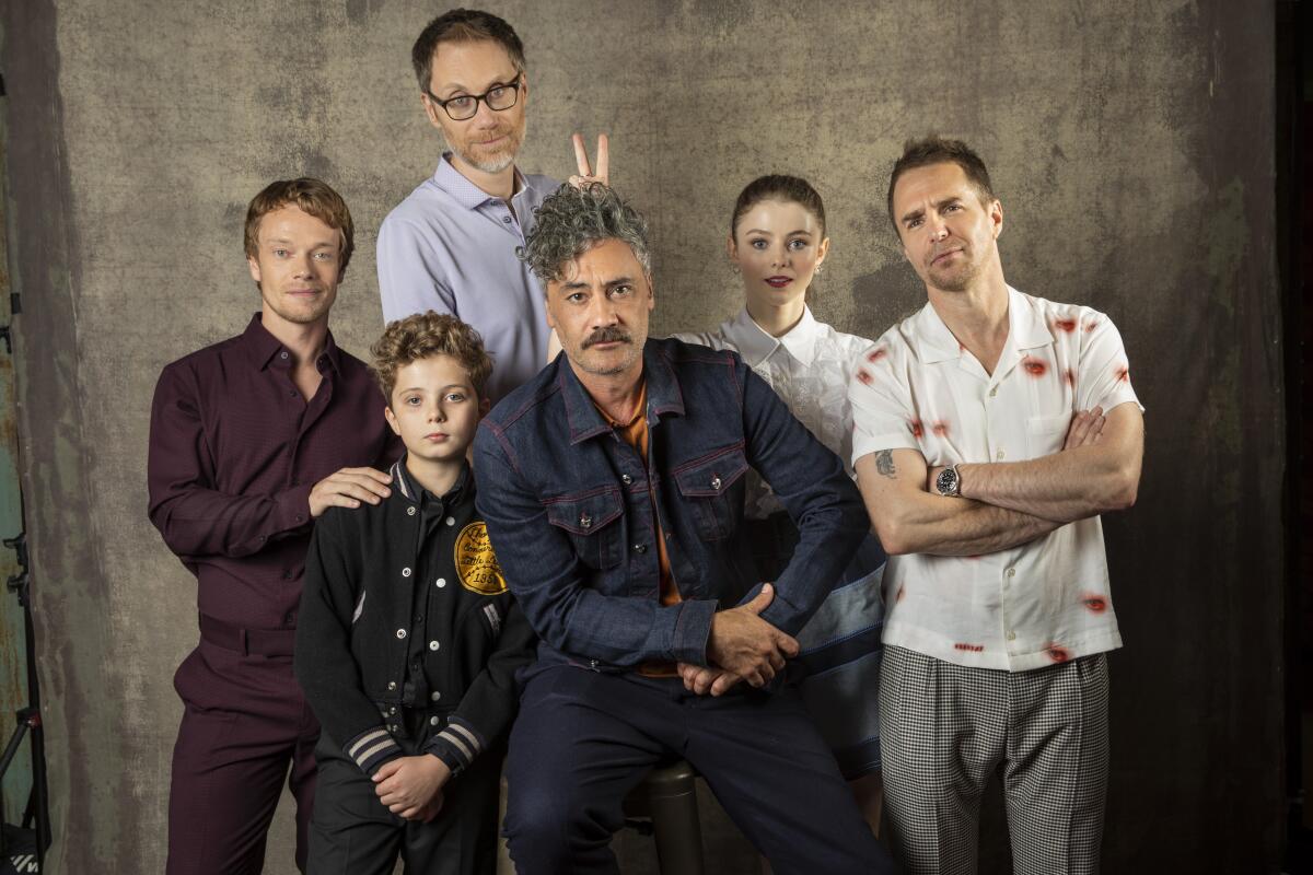 Actors Alfie Allen, Roman Griffin Davis and Stephen Merchant, director-actor Taika Waititi and actors Thomasin McKenzie and Sam Rockwell, from the film "Jojo Rabbit," photographed in the L.A. Times Photo Studio at the 2019 Toronto International Film Festival.