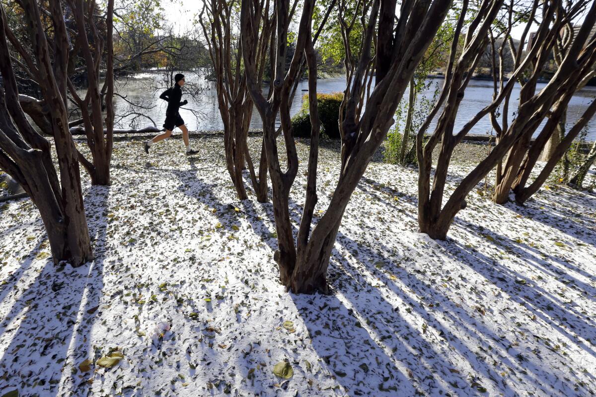 A jogger braves temperatures in the teens as he goes for a run Tuesday in Nashville, Tenn.