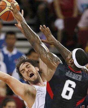 LeBron who? Lakers teammate LeBron James knocks the ball away from Pau during Olympics play.