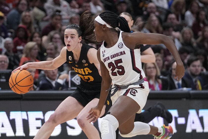 Iowa's Caitlin Clark tries to get past South Carolina's Raven Johnson during the first half of an NCAA Women's Final Four semifinals basketball game Friday, March 31, 2023, in Dallas. (AP Photo/Darron Cummings)