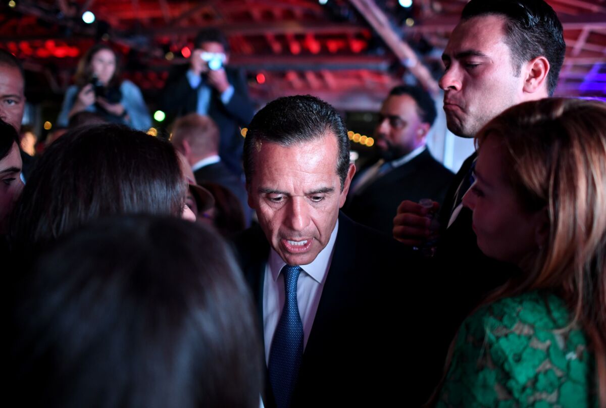 California gubernatorial candidate Antonio Villaraigosa is surrounded by family after delivering his concession speech.