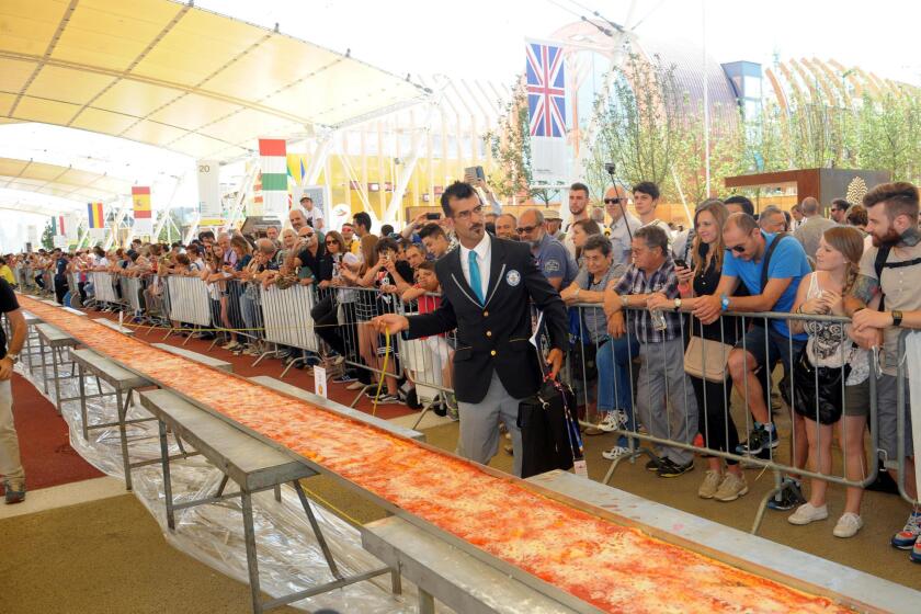 What's the world's record-setting pizza? Sixty pizza makers last month worked on this almost milelong pizza for Expo 2015 near Milan, Italy. Their work paid off: Guinness World Records confirmed it was the world's longest pizza (specifically 1.59545 kilometers).