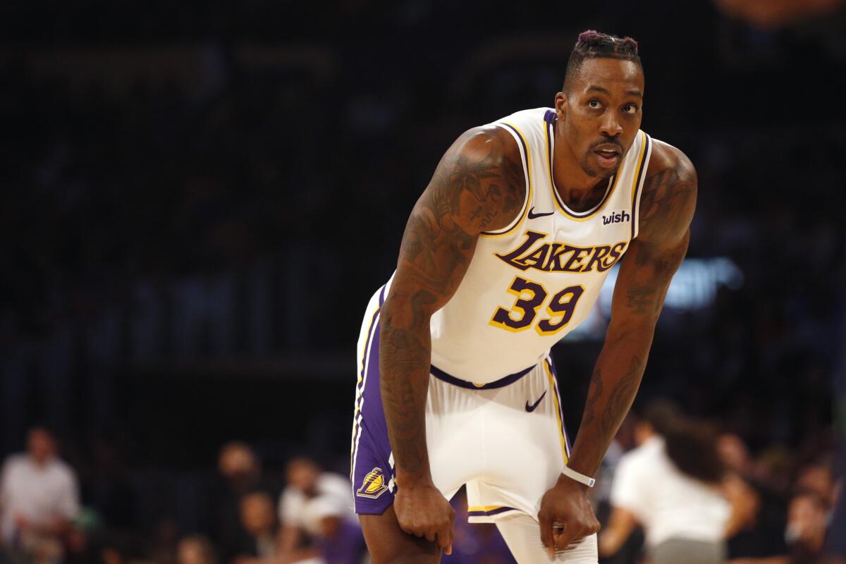 Lakers' Dwight Howard was physical and productive on Tuesday against the Denver Nuggets, scoring 13 points, catching lobs for dunks, collecting six rebounds and blocking two shots.