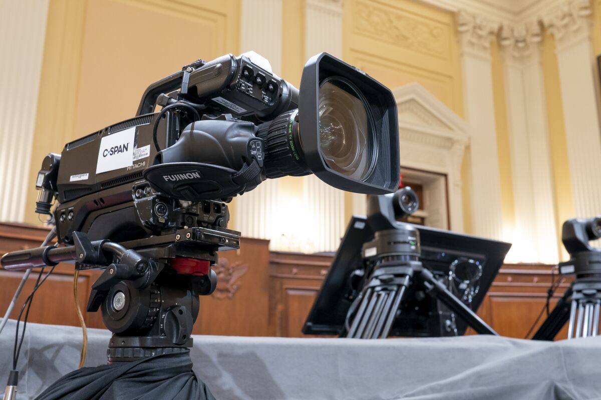 Television crews and technicians prepare the Cannon Caucus Room for Thursday night's hearing.