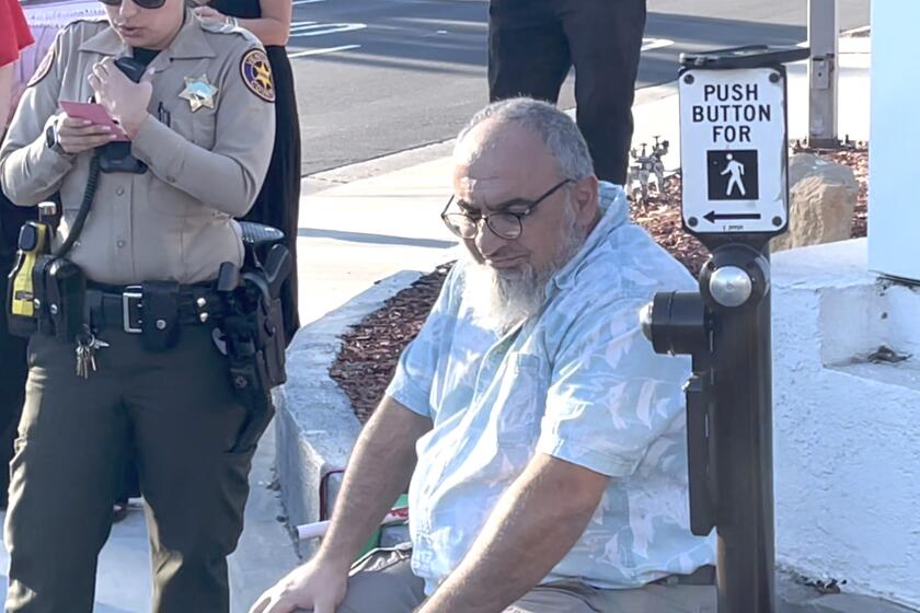 Loay Alnaji (seated) of Moorpark was arrested for the death of Paul Kessler. 