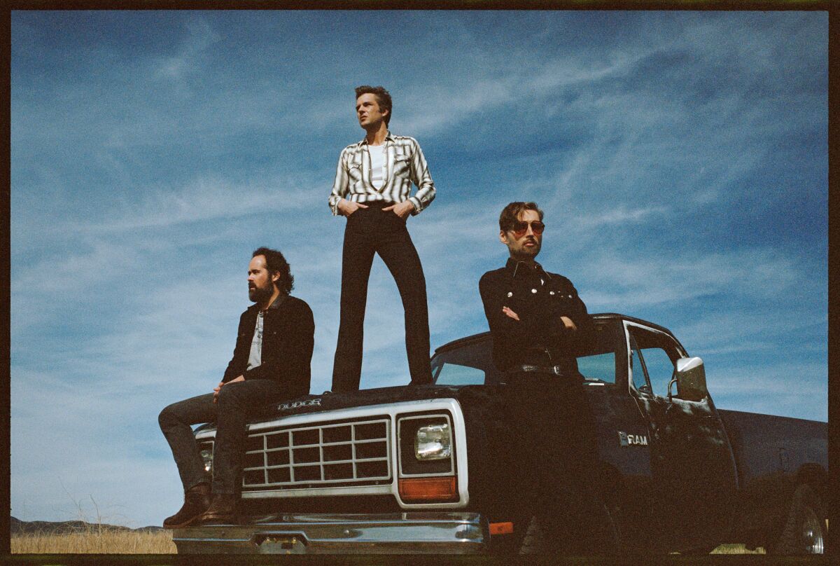 Ronnie Vannucci Jr., Brandon Flowers and Mark Stoermer of the Killers
