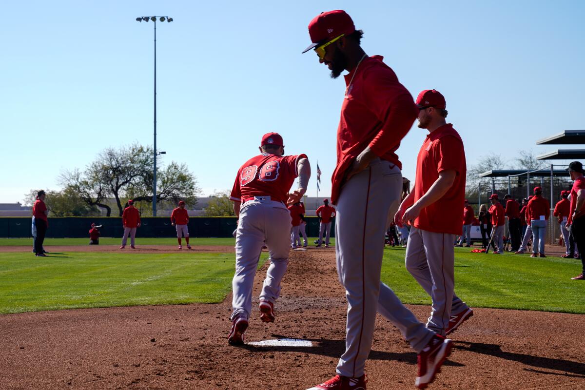 Jack Kruger (98) takes off in a sprint, during Angels spring training practice at Tempe Diablo Stadium