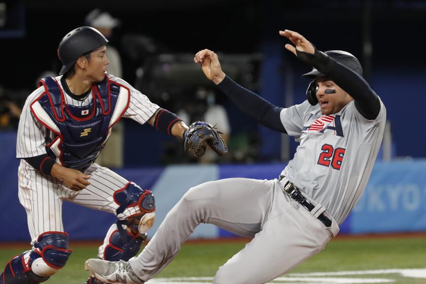 TOKYO, - AUGUST 02: Triston Casas from Team USA slides into home plate.
