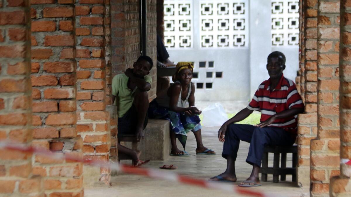 People believed to have Ebola wait for treatment at an isolation ward in Bikoro, Democratic Republic of Congo.