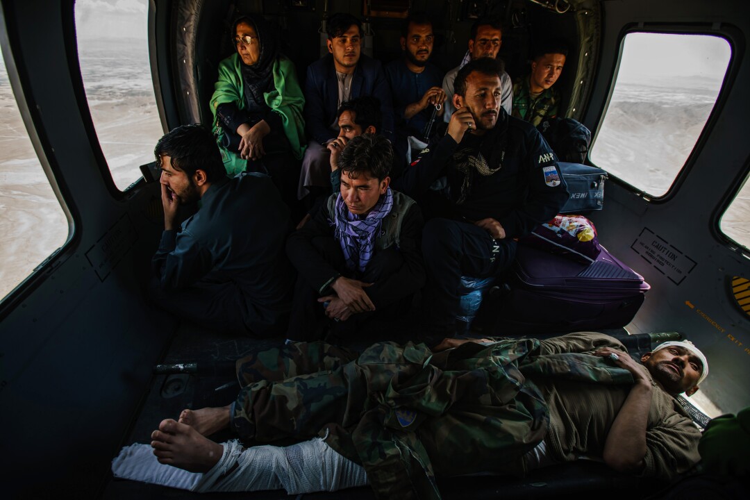 Hosy Andar, deputy governor of Ghazni province, top left, and other soldiers are transported to Kabul Airbase